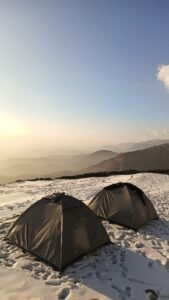 Scenic view of Thathrana Trek with Himalayan mountains and lush green forest